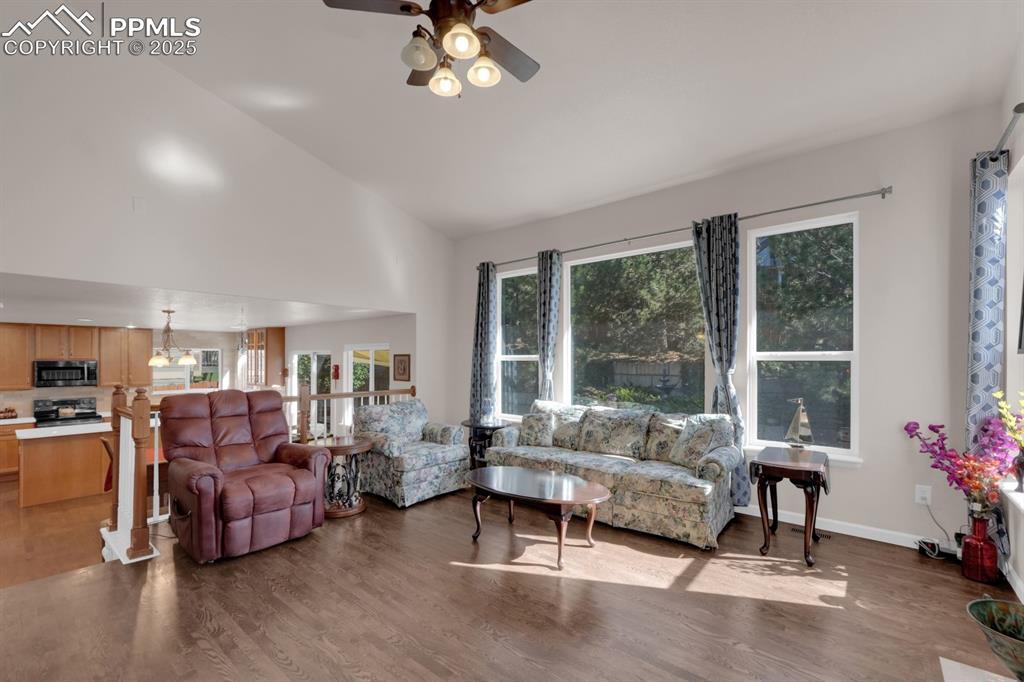 Image 9 of 43: Living room flows into dining and kitchen area
