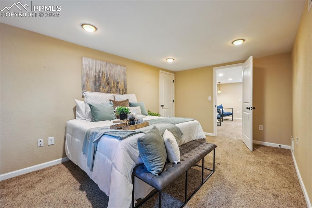 Image 20 of 31: Primary bedroom is located in the basement