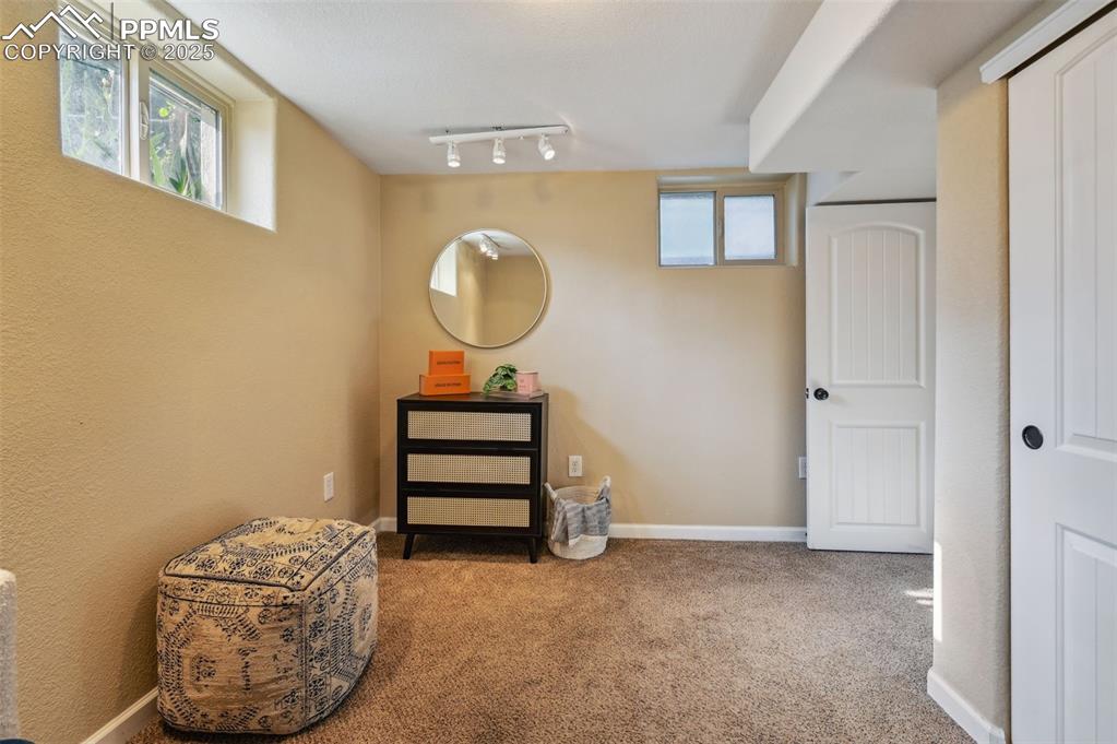 Image 22 of 31: The bonus room adjoins to the primary bedroom.