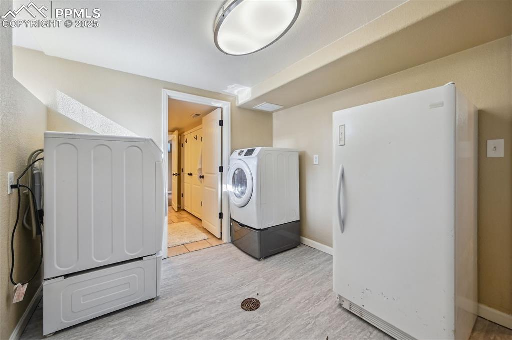 Image 27 of 31: Walk-out basement access is located in the laundry room.