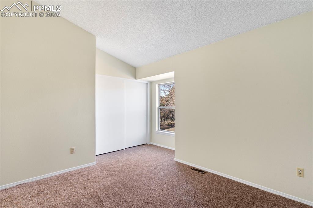 Image 11 of 17: Front bedroom