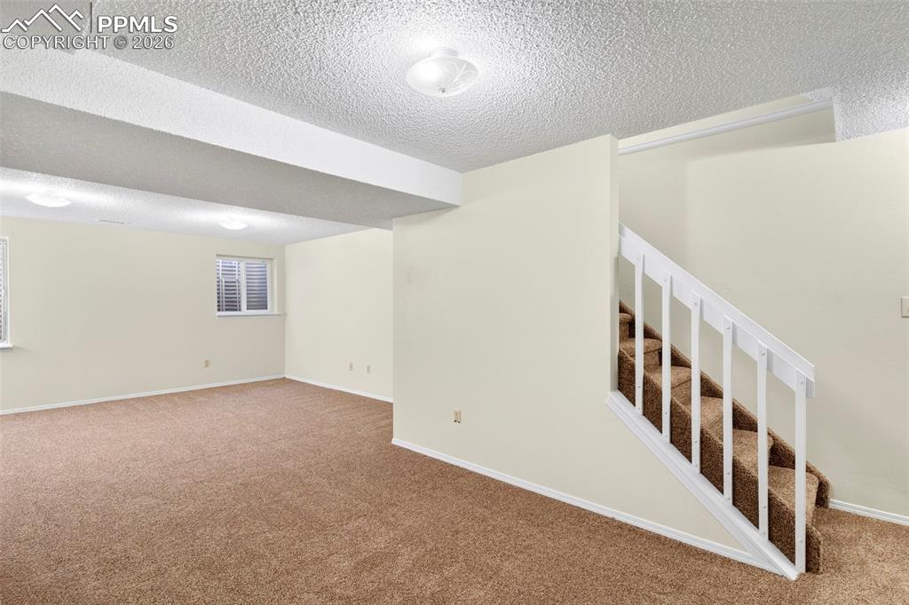 Image 13 of 17: The huge basement could be used as a family room or bedroom.