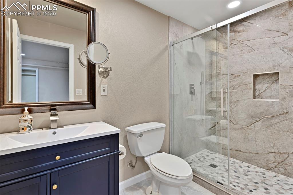 Image 28 of 30: Bedroom #5 - basement; log furniture options in garage