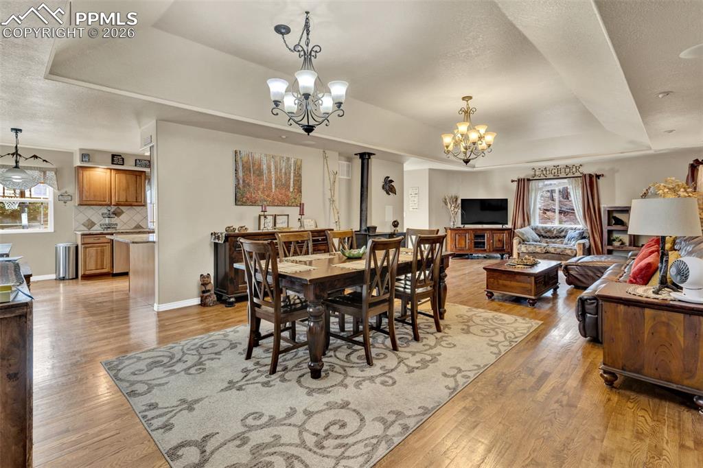 Image 9 of 30: Welcome to the openness of dining, living room, and kitchen