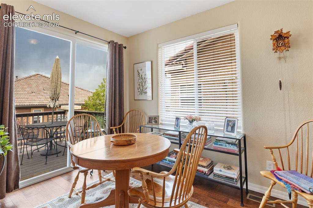 Image 13 of 28: Sliding glass doors opening to an exterior deck.