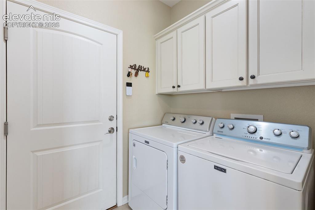 Image 18 of 28: Laundry area with access