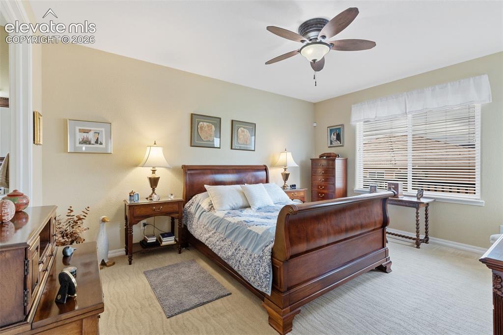 Image 8 of 28: Expansive room featuring neutral wall tones and textured carpeting