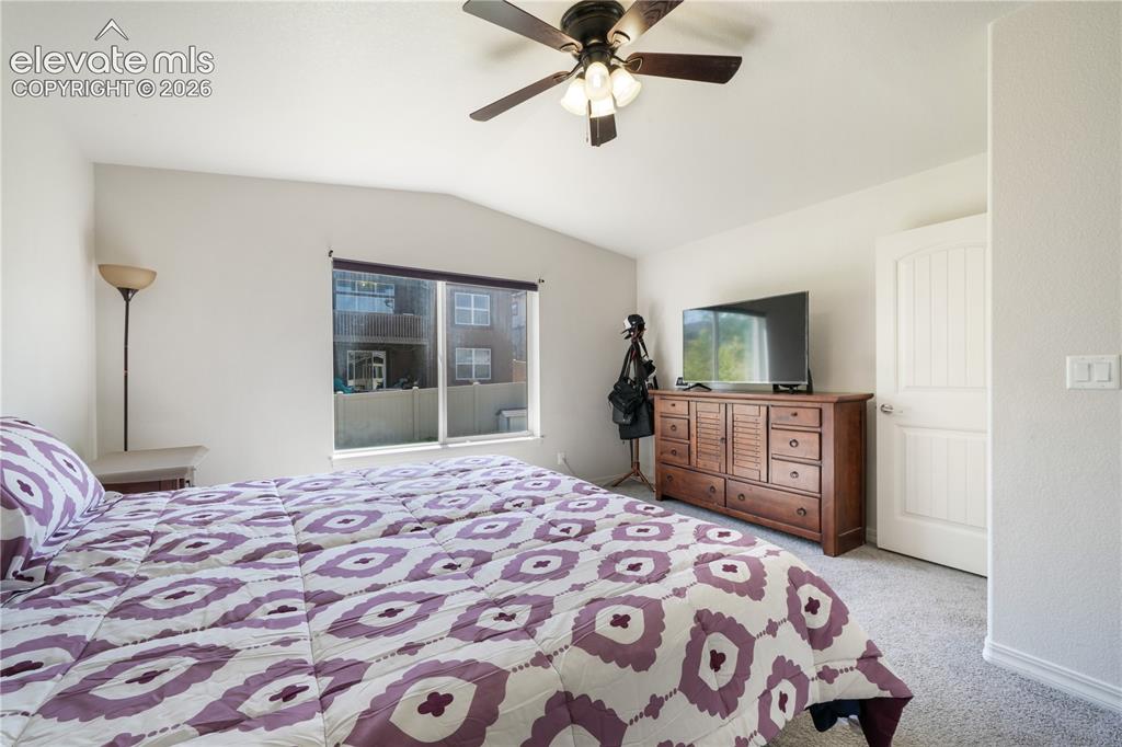 Image 19 of 50: Main level primary bedroom with ensuite 5 piece bathroom with granite count