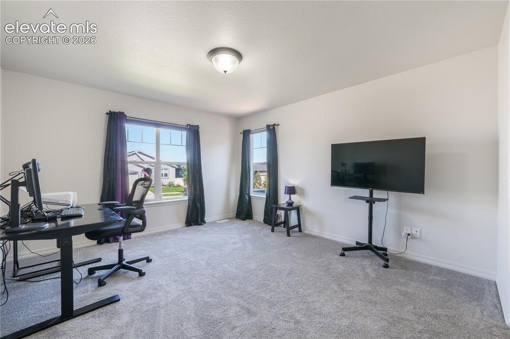 Image 23 of 50: Main level 2nd bedroom with ensuite 3/4 bathroom, dual closets and new carp