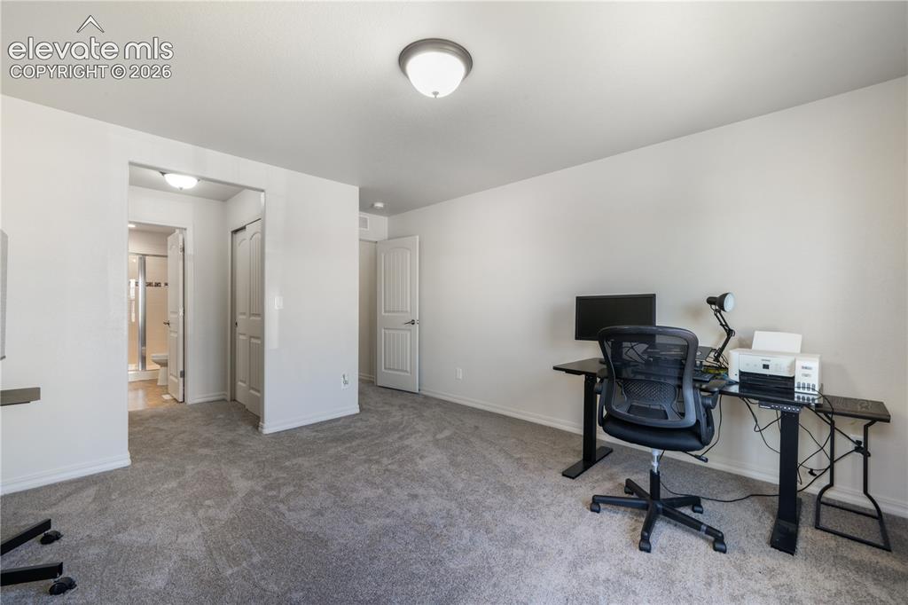 Image 24 of 50: Main level 2nd bedroom with ensuite 3/4 bathroom, dual closets and new carp