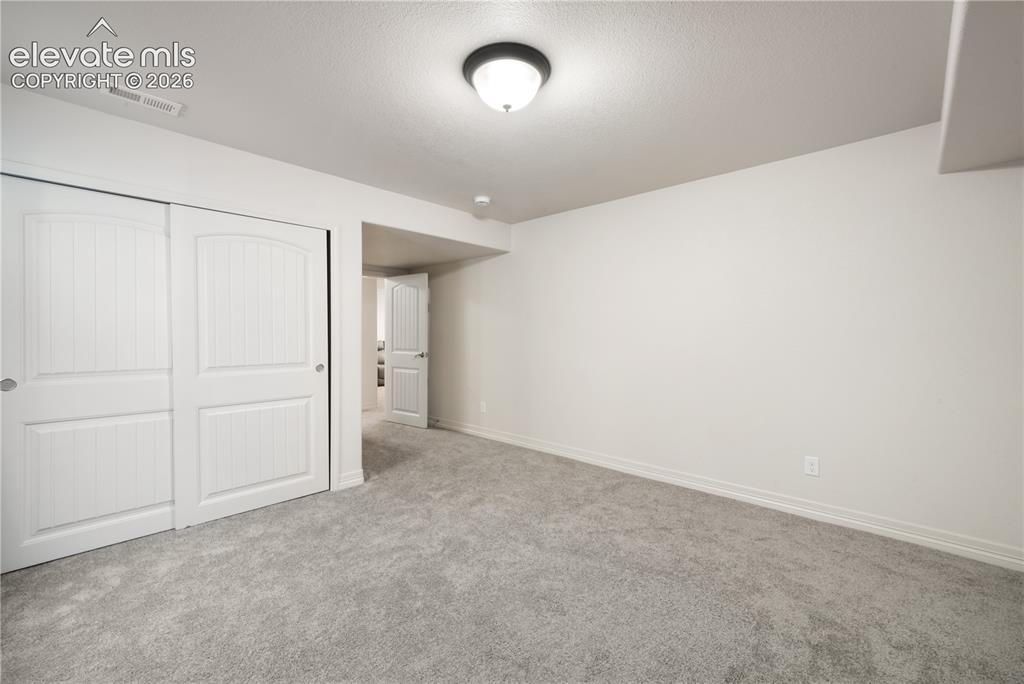 Image 36 of 50: Basement 3rd bedroom new carpet