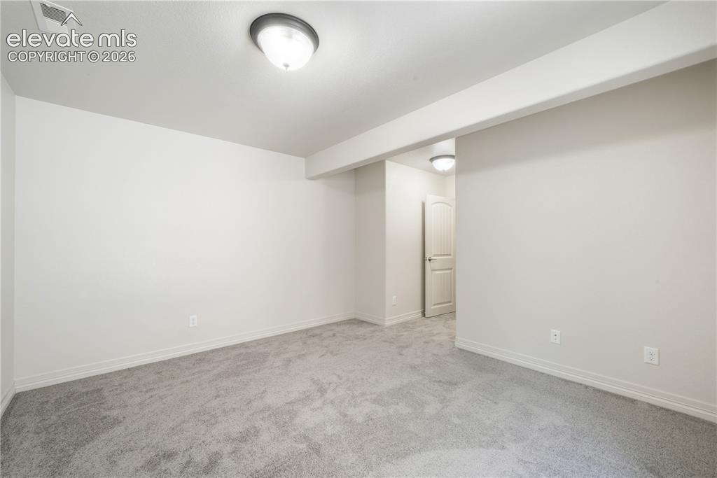 Image 40 of 50: Basement 4th bedroom with large walk in closet and new carpet