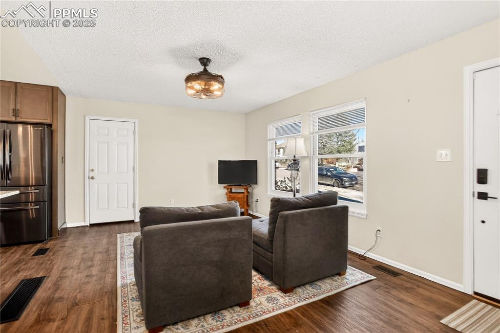 Image 10 of 42: Living room with lots of natural light