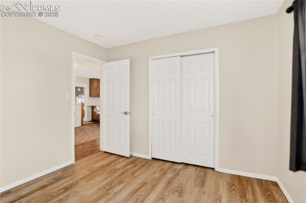 Image 19 of 42: Bedroom 2 just had new LVT installed