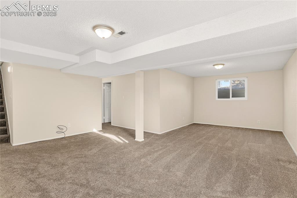 Image 22 of 42: Family room provides nice extra living space