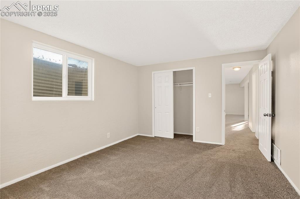 Image 28 of 42: Bedroom 4 closet