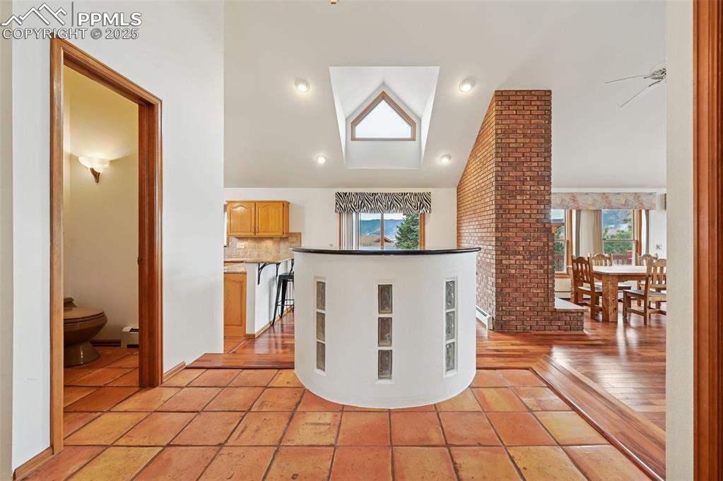 Image 21 of 49: Kitchen with lofted ceiling