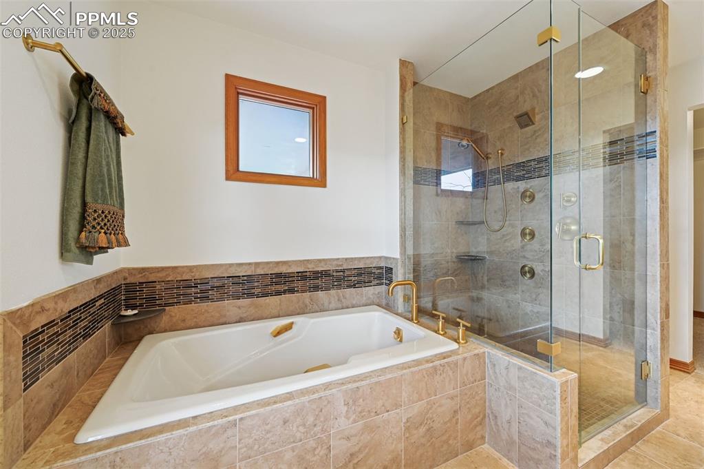 Image 31 of 49: walk in shower and soaking tub 