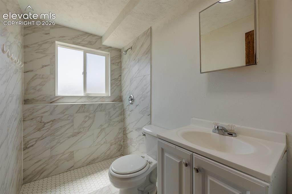 Image 14 of 26: remodeled 3/4 bath near 3rd bedroom and familyroom.
