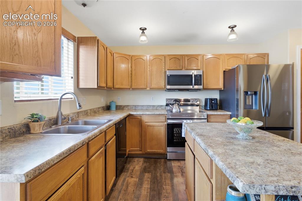 Image 8 of 31: COMPLETE WITH STAINLESS STEEL APPLIANCES.
