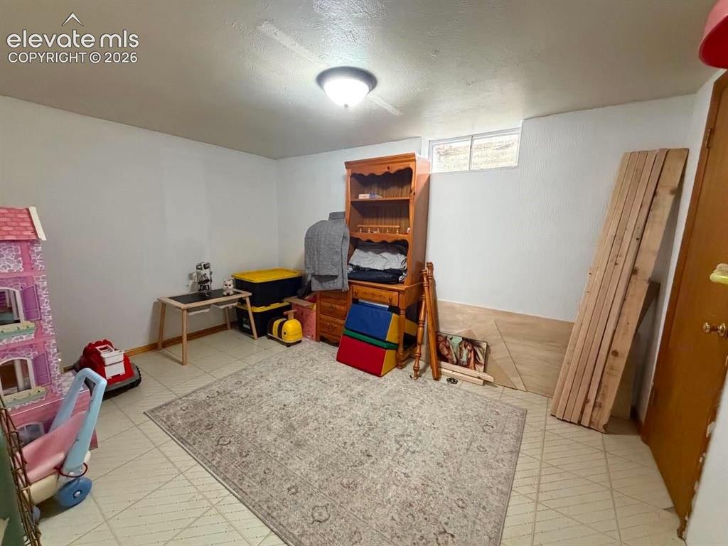 Image 18 of 21: Basement Bedroom