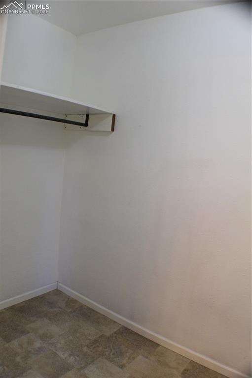 Image 15 of 36: Primary Bedroom Walk-In Closet