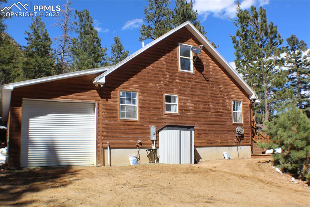 Image 23 of 36: Side of Structure w/Attached Garage Access