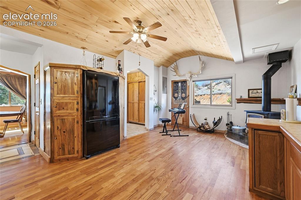 Image 17 of 49: View of the kitchen space looking into the sitting area.