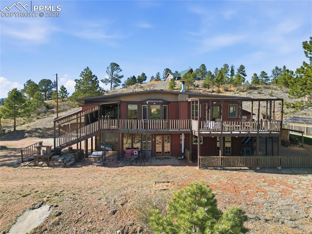 Image 2 of 50: Elevated photo of deck, main floor and lower level