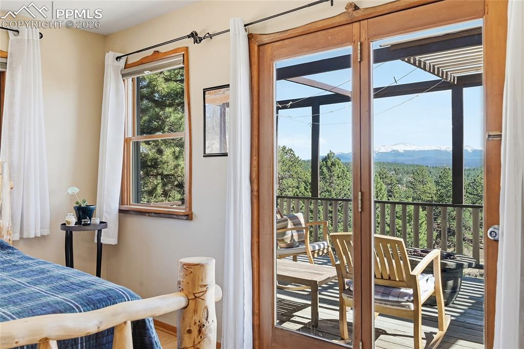 Image 22 of 49: Fantastic view of deck and surrounding area from the bedroom