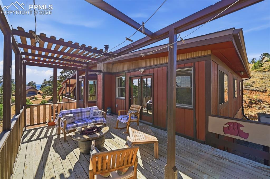 Image 23 of 49: View of the entire deck sitting area.