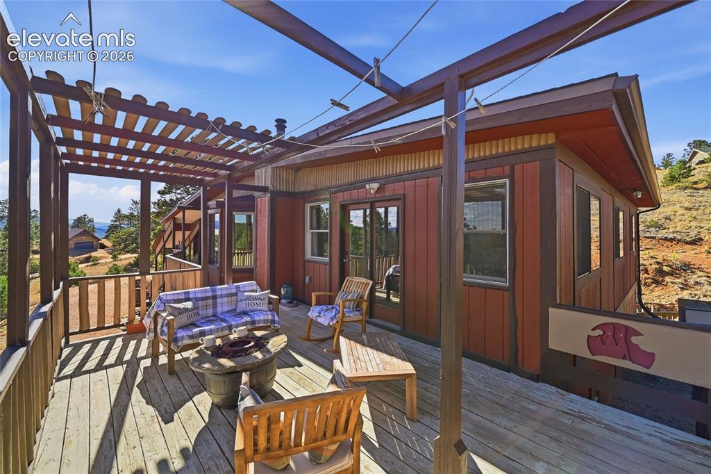 Image 25 of 49: View of the entire deck sitting area.