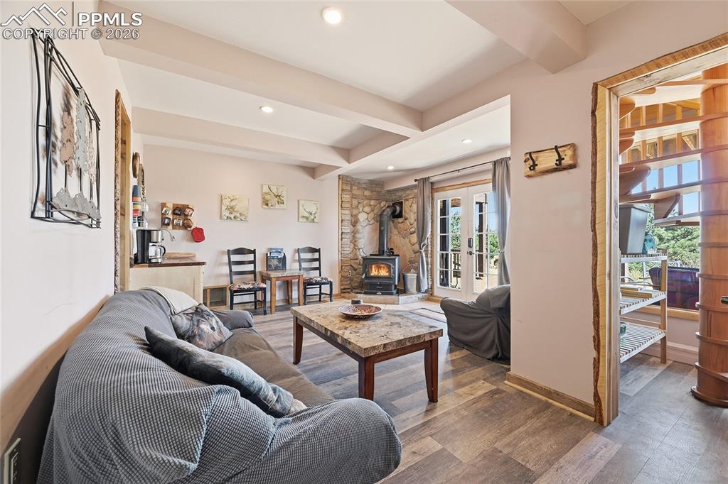 Image 28 of 50: Awesome cozy living room for additional family or guests. Furniture remains