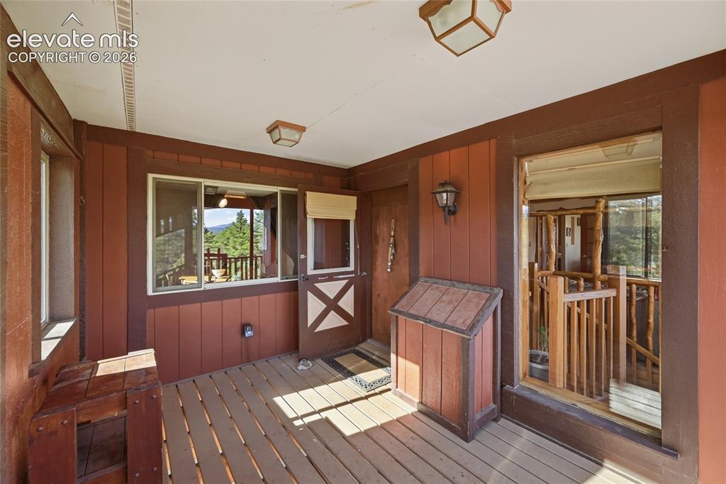 Image 36 of 49: Covered front door entrance