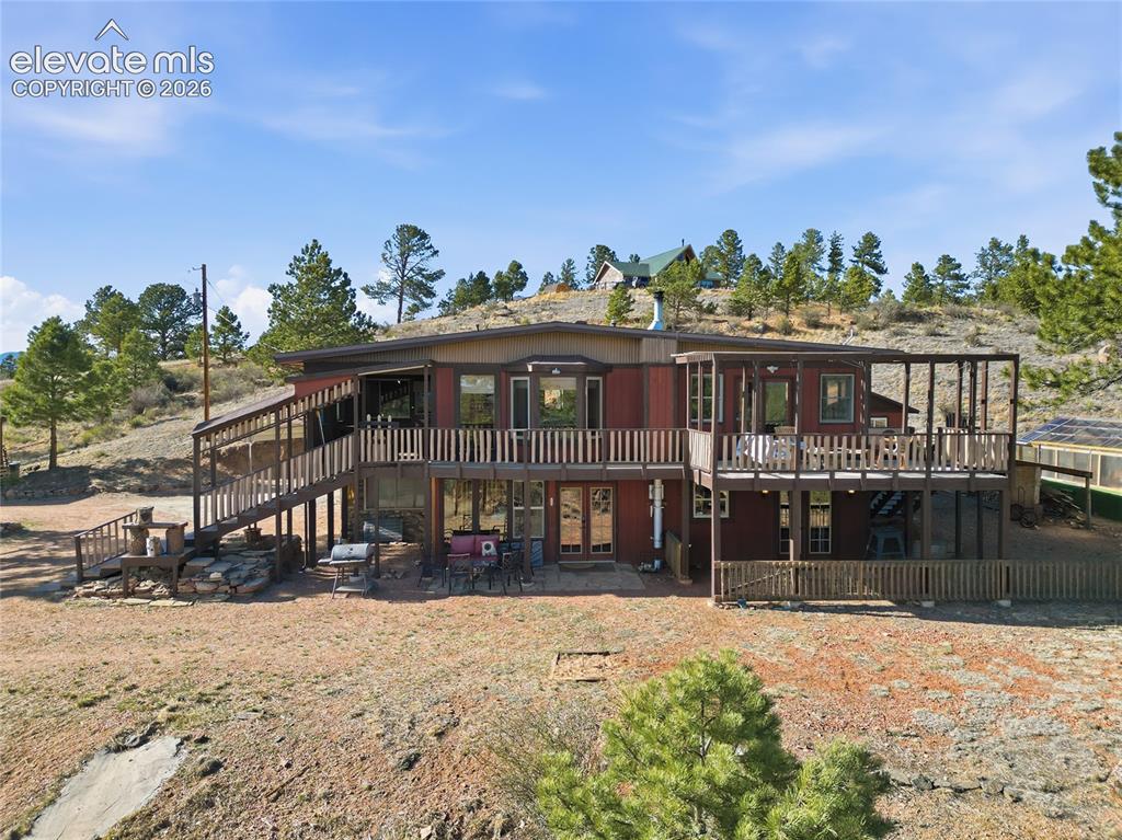 Image 45 of 49: Elevated photo of deck, main floor and lower level