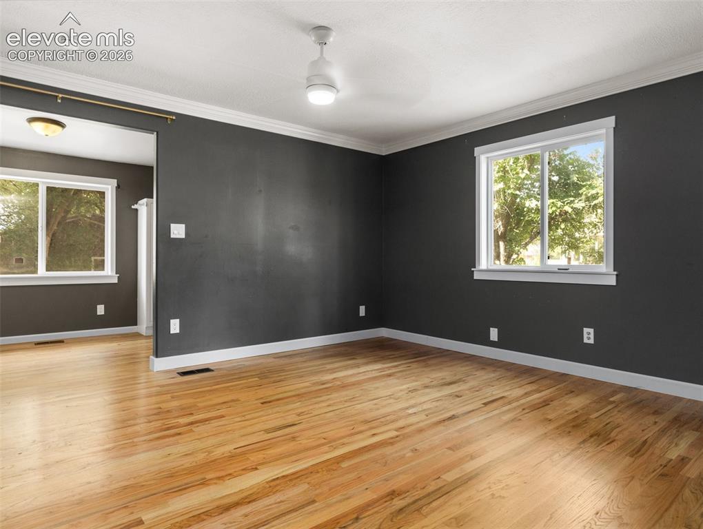Image 13 of 35: Hardwood flooring extending throughout the space