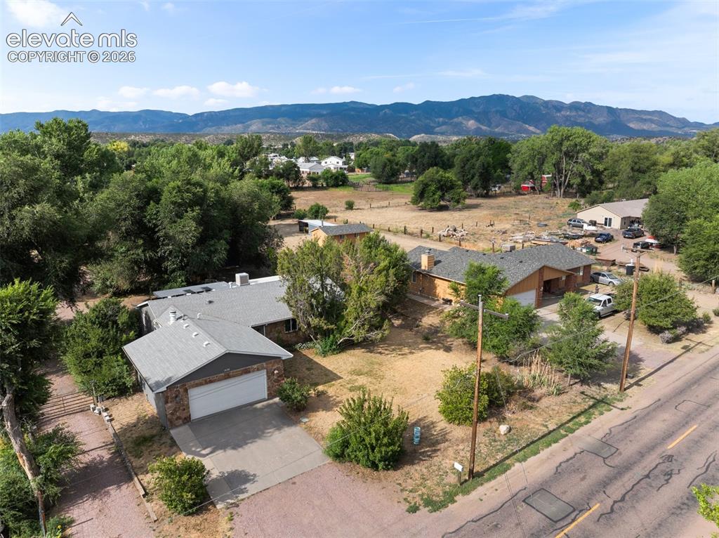 Image 31 of 35: Expansive property featuring two distinct single-story residences