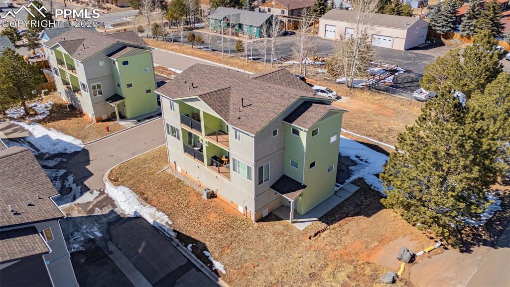 Image 28 of 37: Birds eye view of property with a residential view