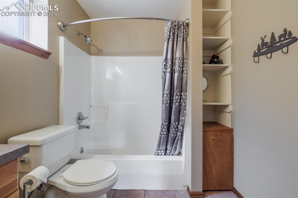 Image 25 of 33: Lower level full bathroom