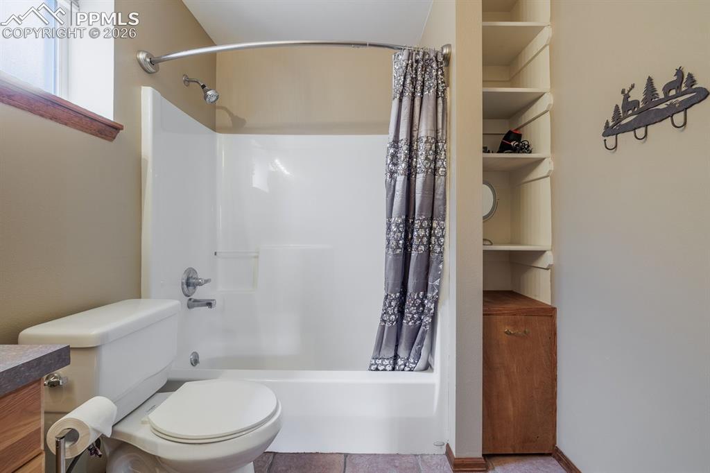 Image 25 of 33: Lower level full bathroom