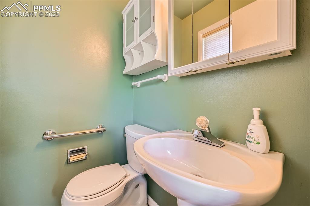Image 18 of 33: Bathroom with a sink and toilet