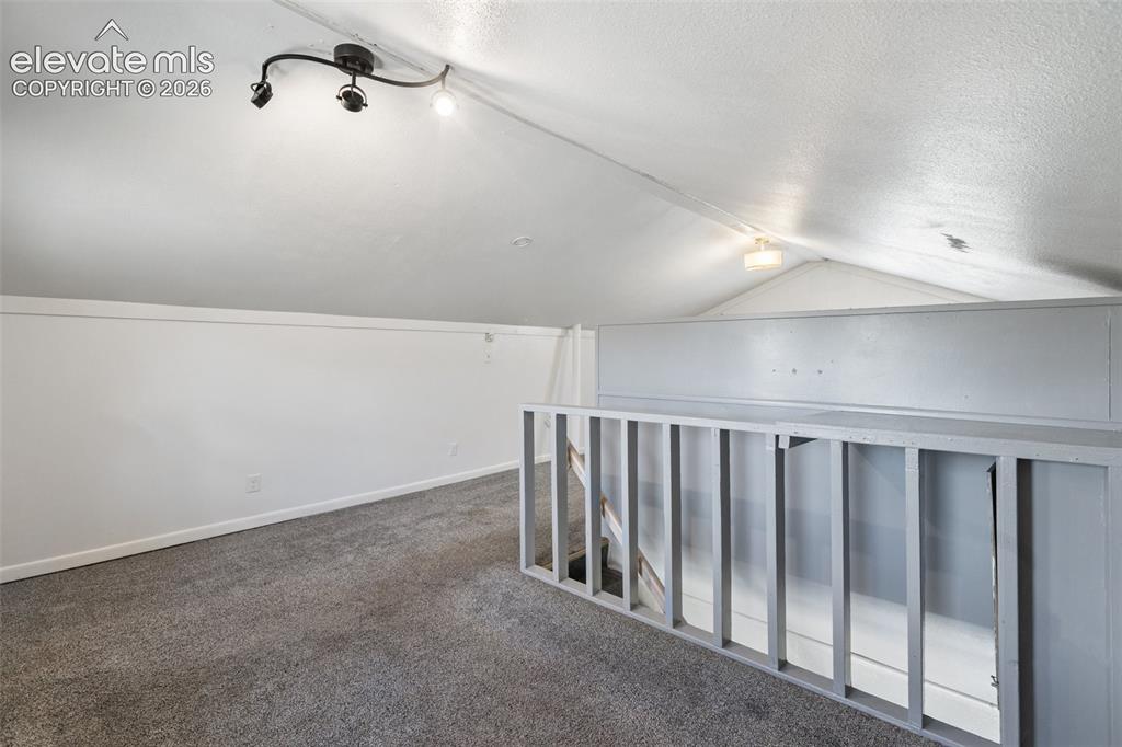Image 20 of 40: Upstairs bedroom area