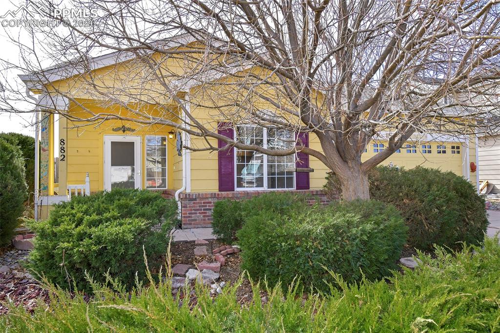 Image 1 of 28: View of front of home featuring brick siding