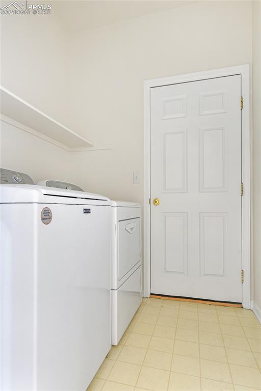 Image 21 of 28: Laundry area featuring separate washer and dryer