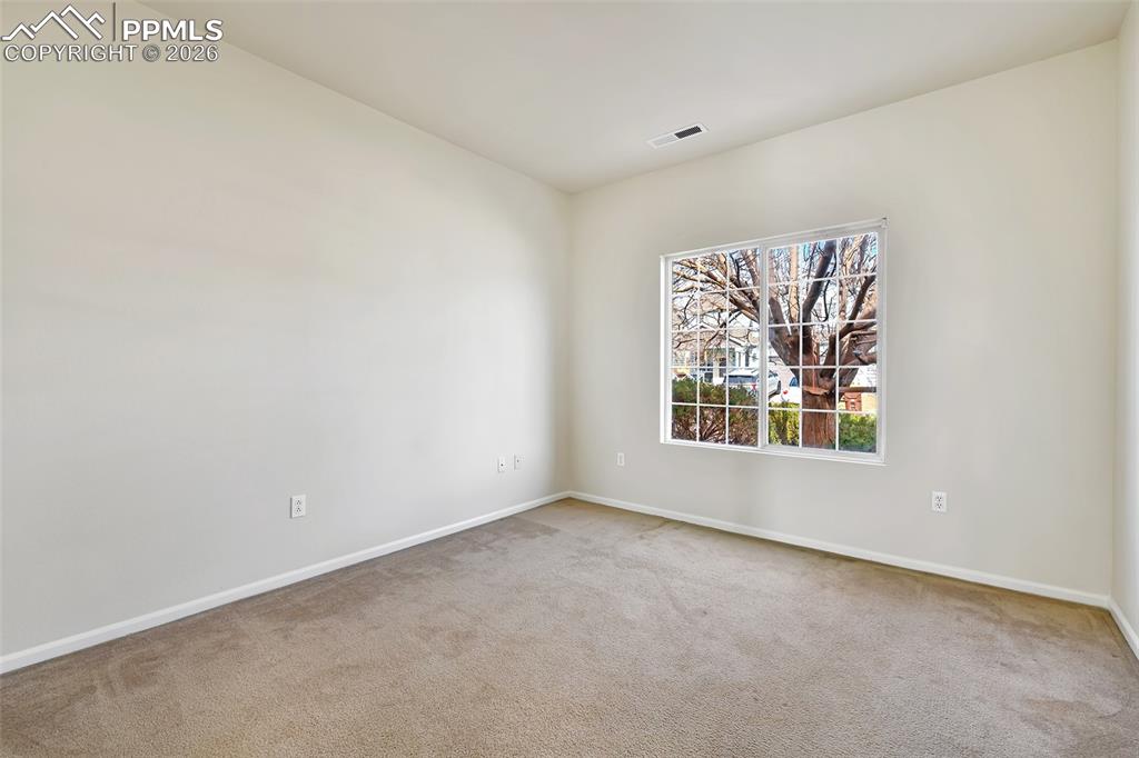 Image 9 of 28: Unfurnished room featuring baseboards and carpet