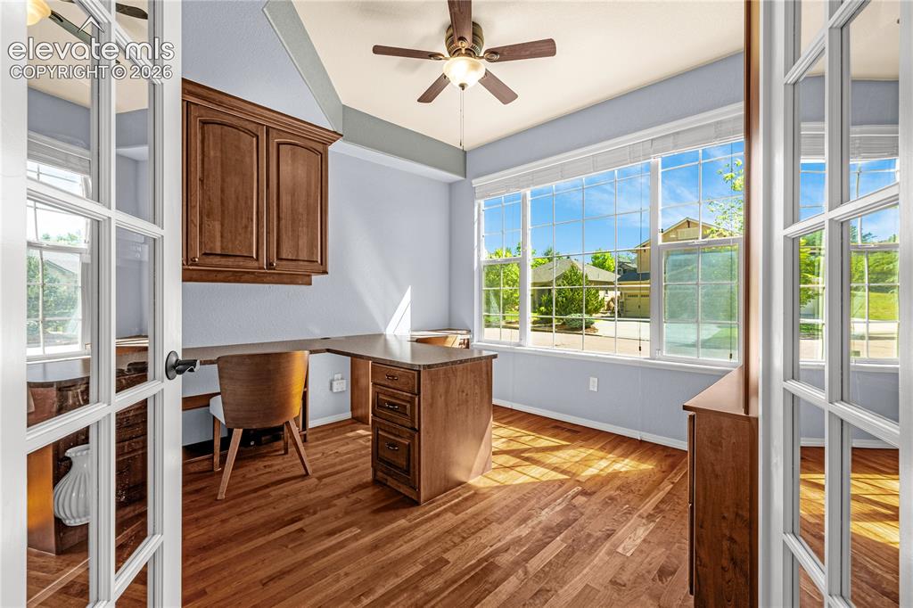 Image 16 of 41: Built-in display shelves, cabinets and desk