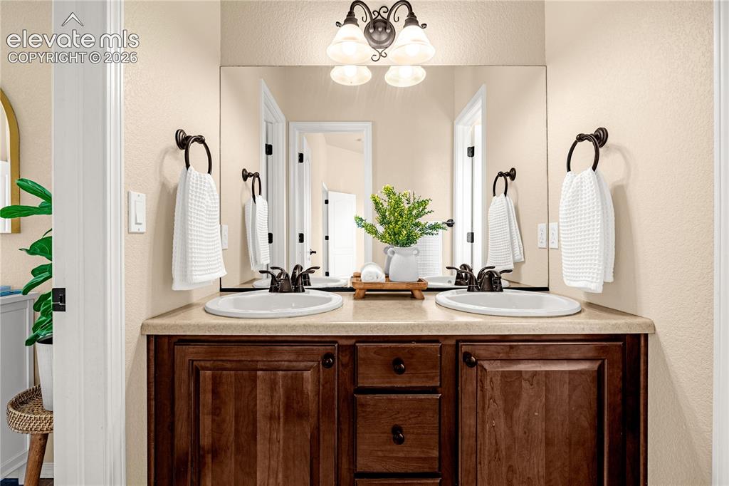 Image 30 of 41: Double sinks in the upstairs Jack & Jill bath