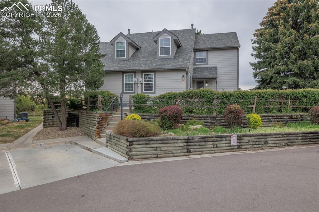 Caption: Fabulous one owner end unit backing to open space with Cheyenne Mountain views