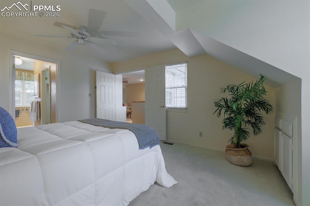 Image 25 of 47: Primary bedroom retreat with doors to loft and primary bath