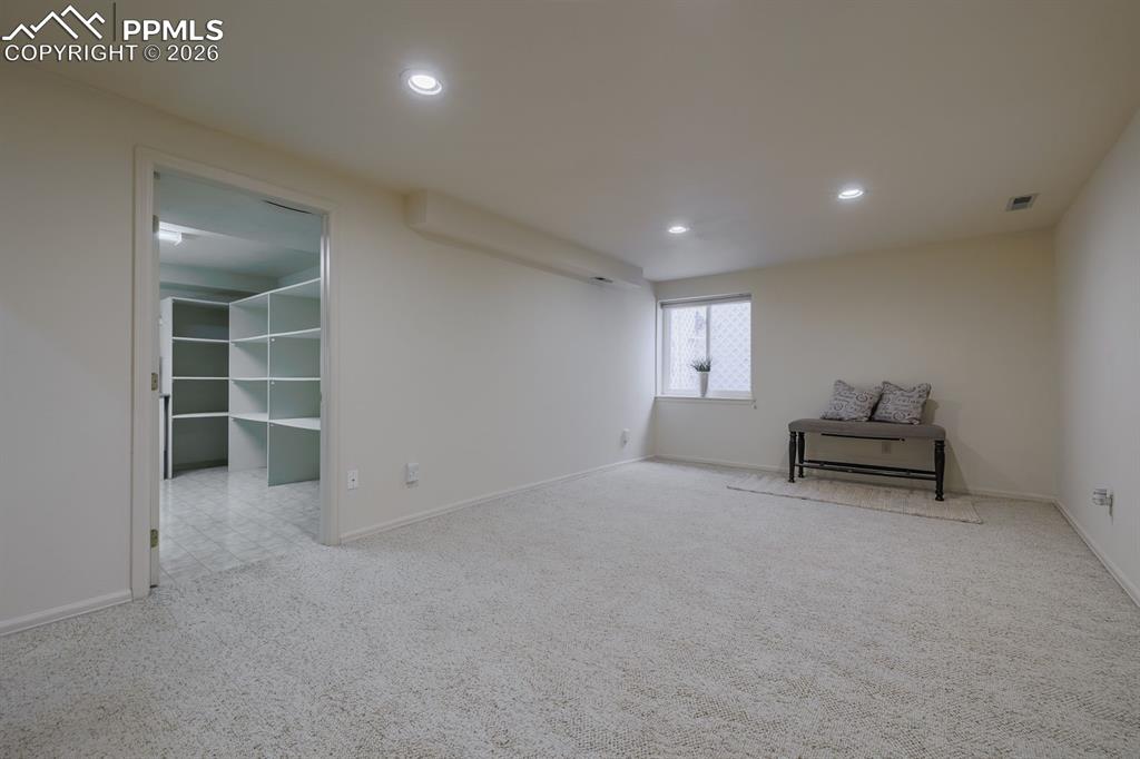 Image 31 of 47: Laundry room with built in shelving